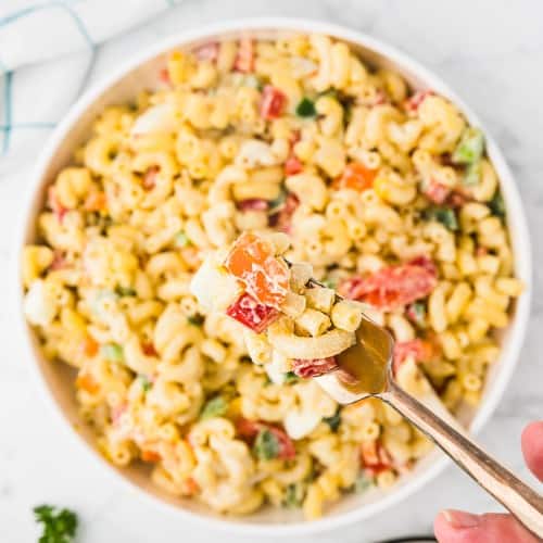 Amish Macaroni salad in a white bowl.