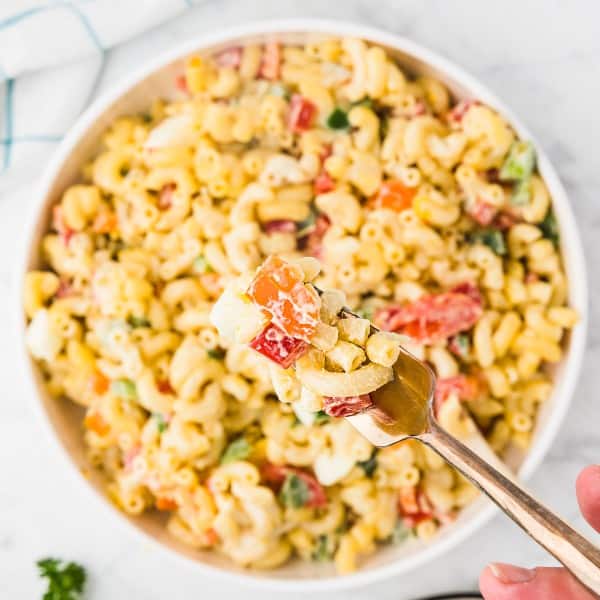 Amish Macaroni salad in a white bowl.