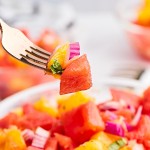 A forkful of Watermelon and Orange Salad.