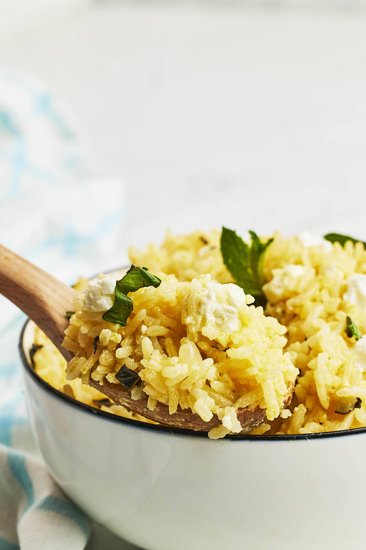A spoonful of freshly cooked Mint Rice with Feta cheese.