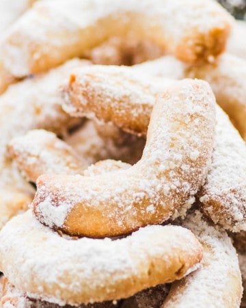 A plate of freshly baked almond crescent cookies also known as Vanillekipferl.