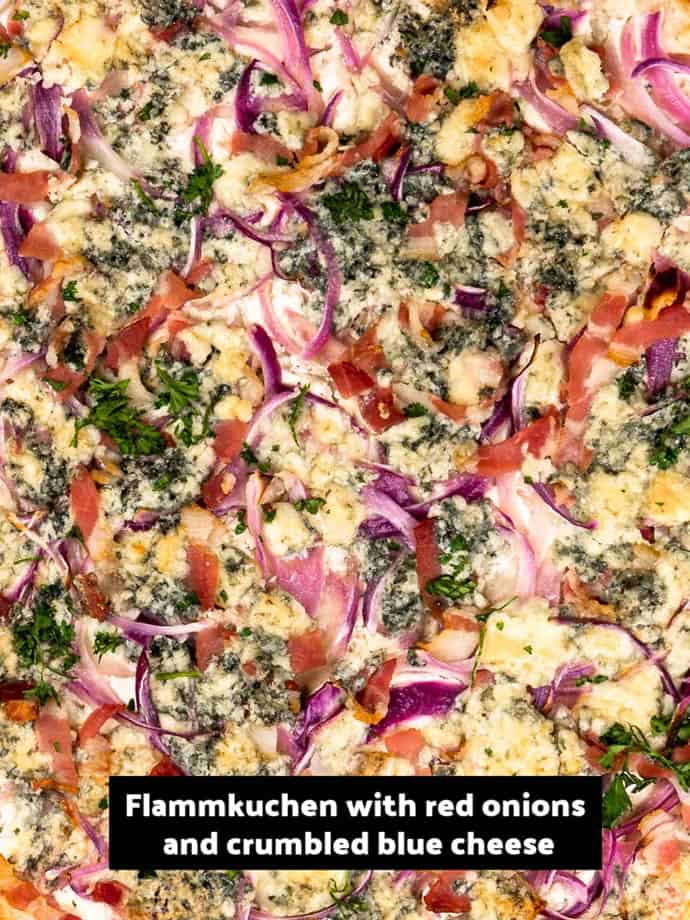 Alternative version of Flammkuchen, topped with crumbled blue cheese and red onion