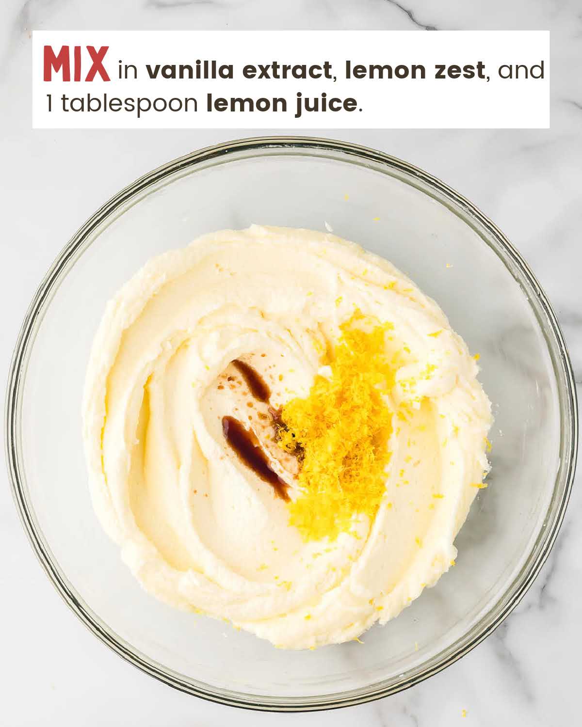 Vanilla extract, lemon zest, and lemon juice on top of batter in a bowl.