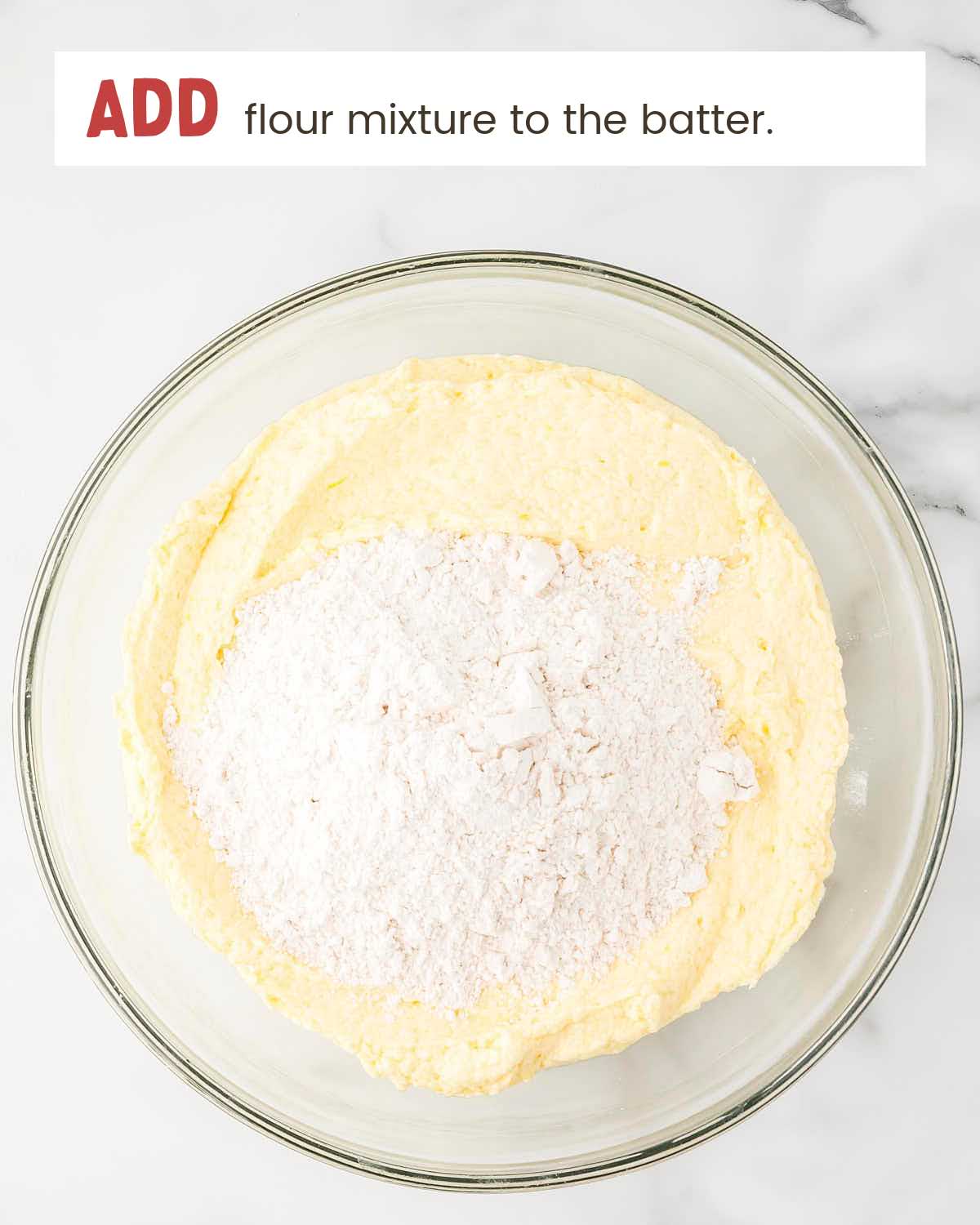 Flour on top of batter in a bowl.