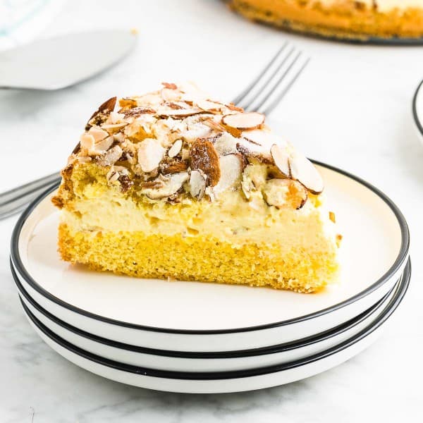 A slice of Bee Sting Cake on a white plate.