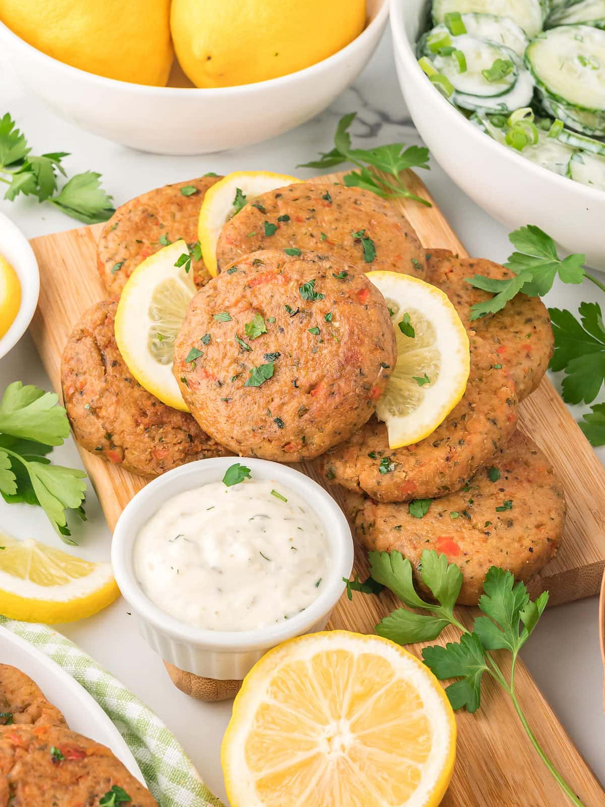 Tuna Cakes served on a wooden board.