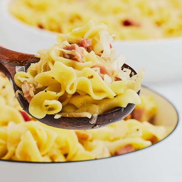 A spoonful of fried cabbage noodles (German Krautfleckerl).