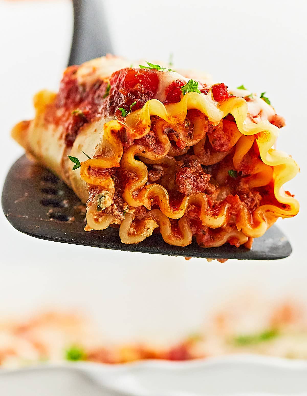 A Lasagna Roll-Up on a large spatula.