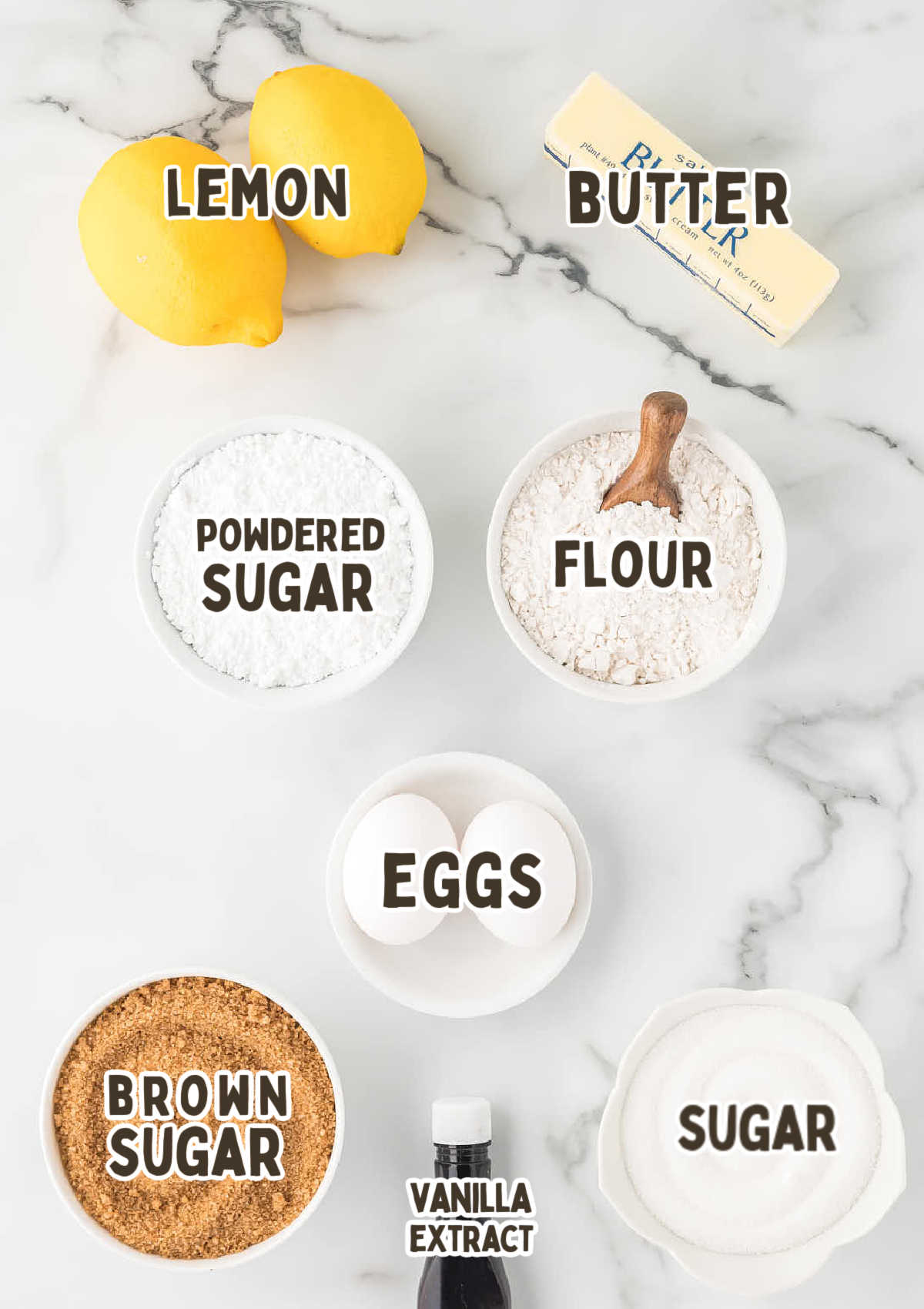 Ingredients for Lemon Shortbread Cookies on a marble countertop.