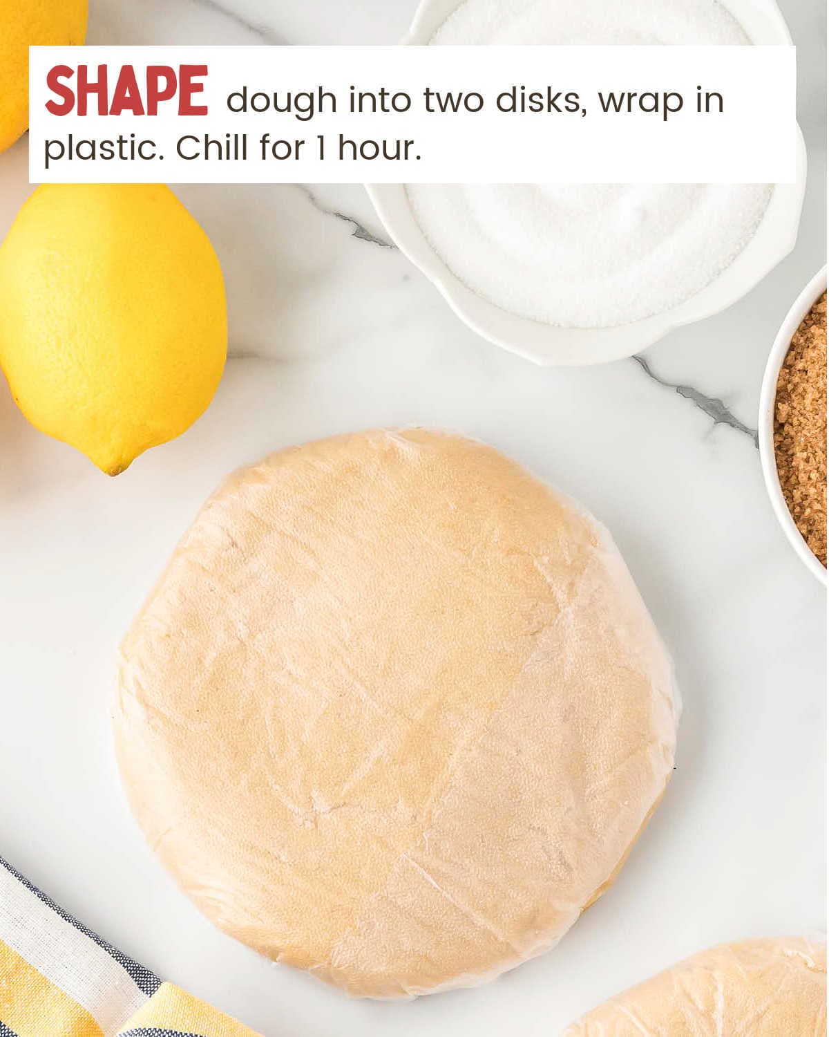 Lemon Shortbread Cookies dough wrapped in plastic wrap.