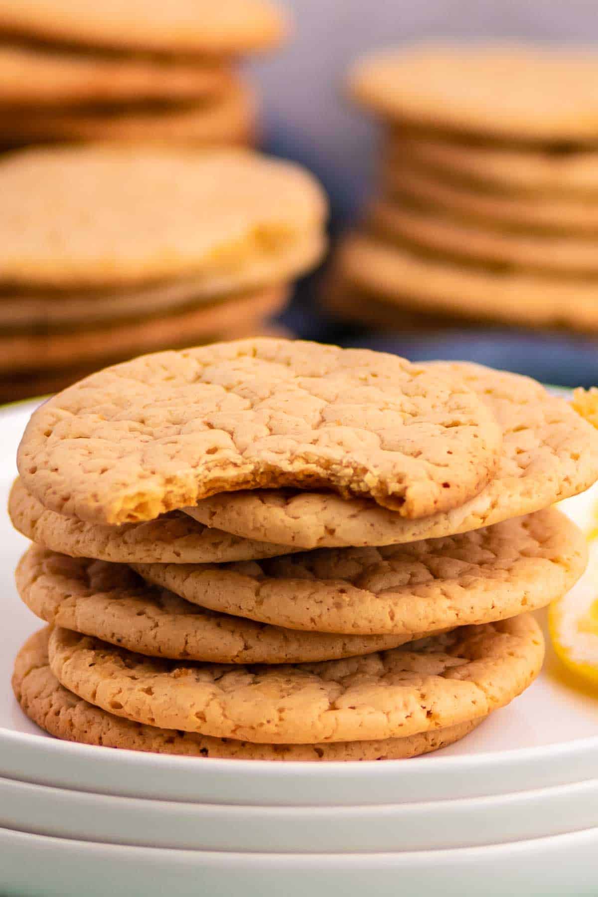 a stack of lemon shortbread cookies on white plates