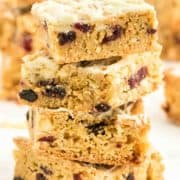 a stack of freshly bake White Chocolate and Cranberry Blondies