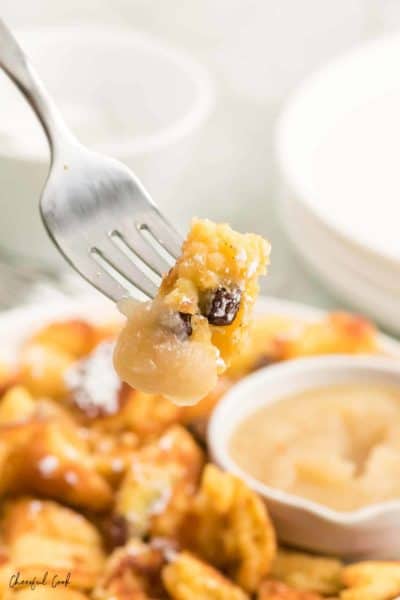 a forkful of freshly made Kaiserschmarnn with apple sauce