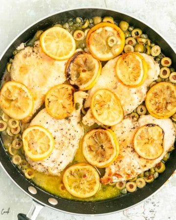 roasted lemon chicken in a black pan