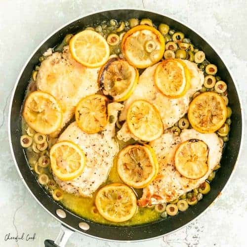 roasted lemon chicken in a black pan