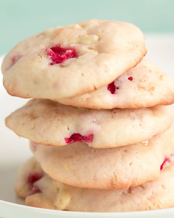 a stack of freshly baked strawberry cheesecake cookies
