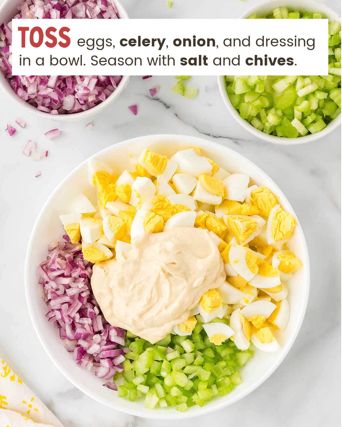Mixing chopped ingredients in a bowl for Egg Salad.