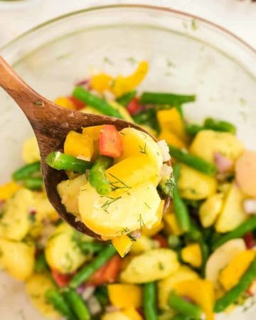 a spoonful of freshly made Potato and Green Bean Salad