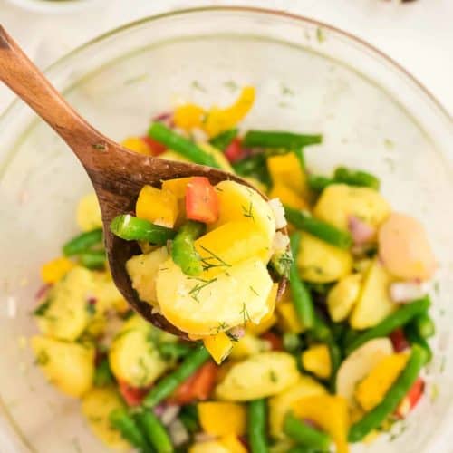 A spoonful of freshly made Potato and Green Bean Salad.