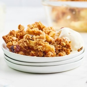 Freshly baked Apple Crisp served with a scoop of vanilla ice cream.