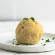 German Potato Dumplings - Kartoffelklösse on a white plate