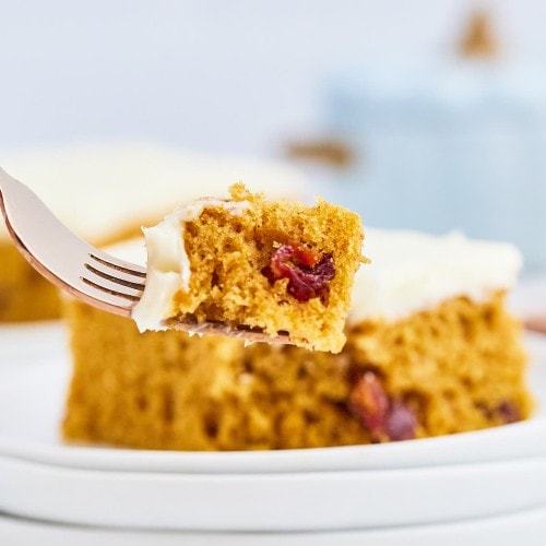 A forkful of a piece of frosted Pumpkin Bars.
