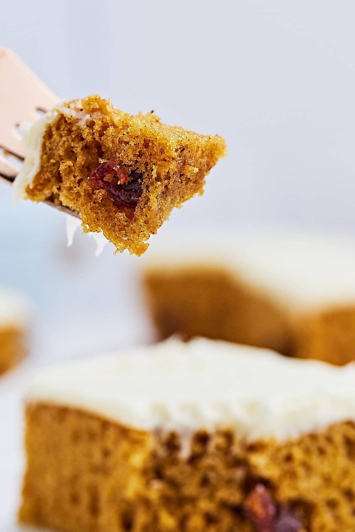 A forkful of frosted Pumpkin Bars.