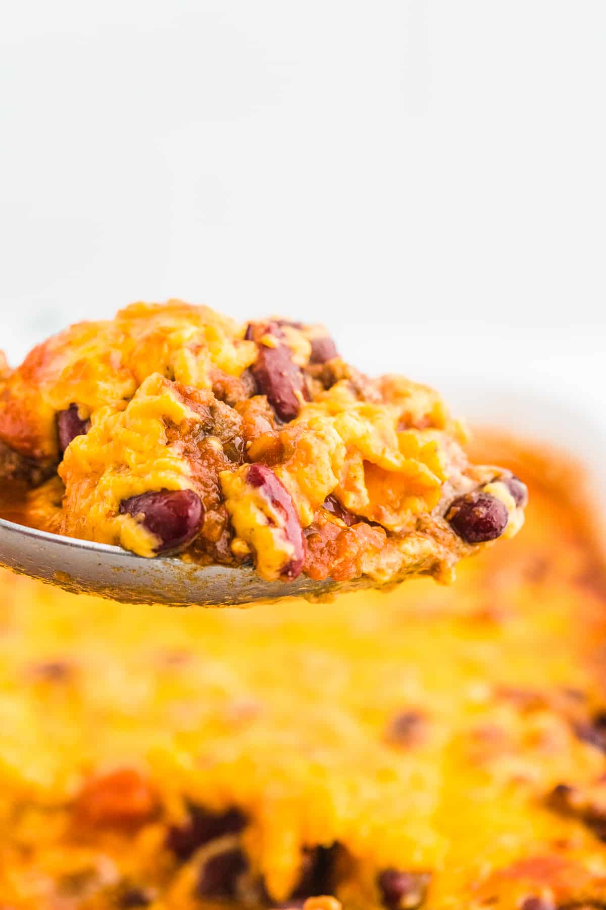 A spoonful of freshly baked cheesy Beef & Bean Casserole.