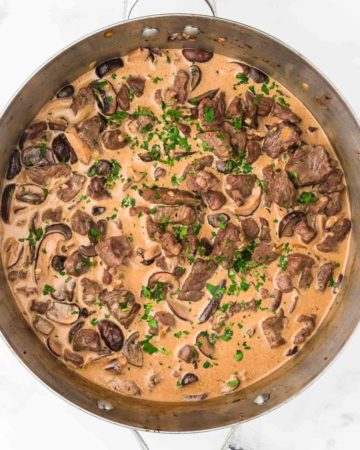 a skillet filled with freshly cooked beef stroganoff