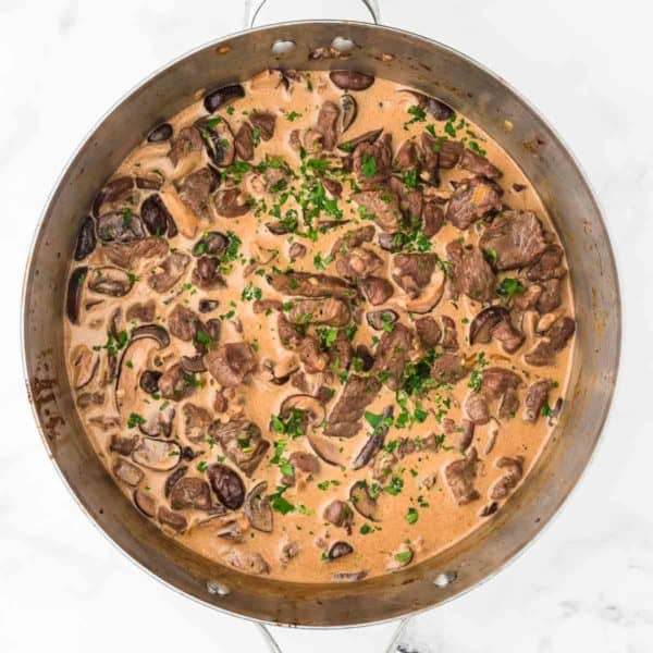 A skillet filled with freshly cooked Beef Stroganoff.