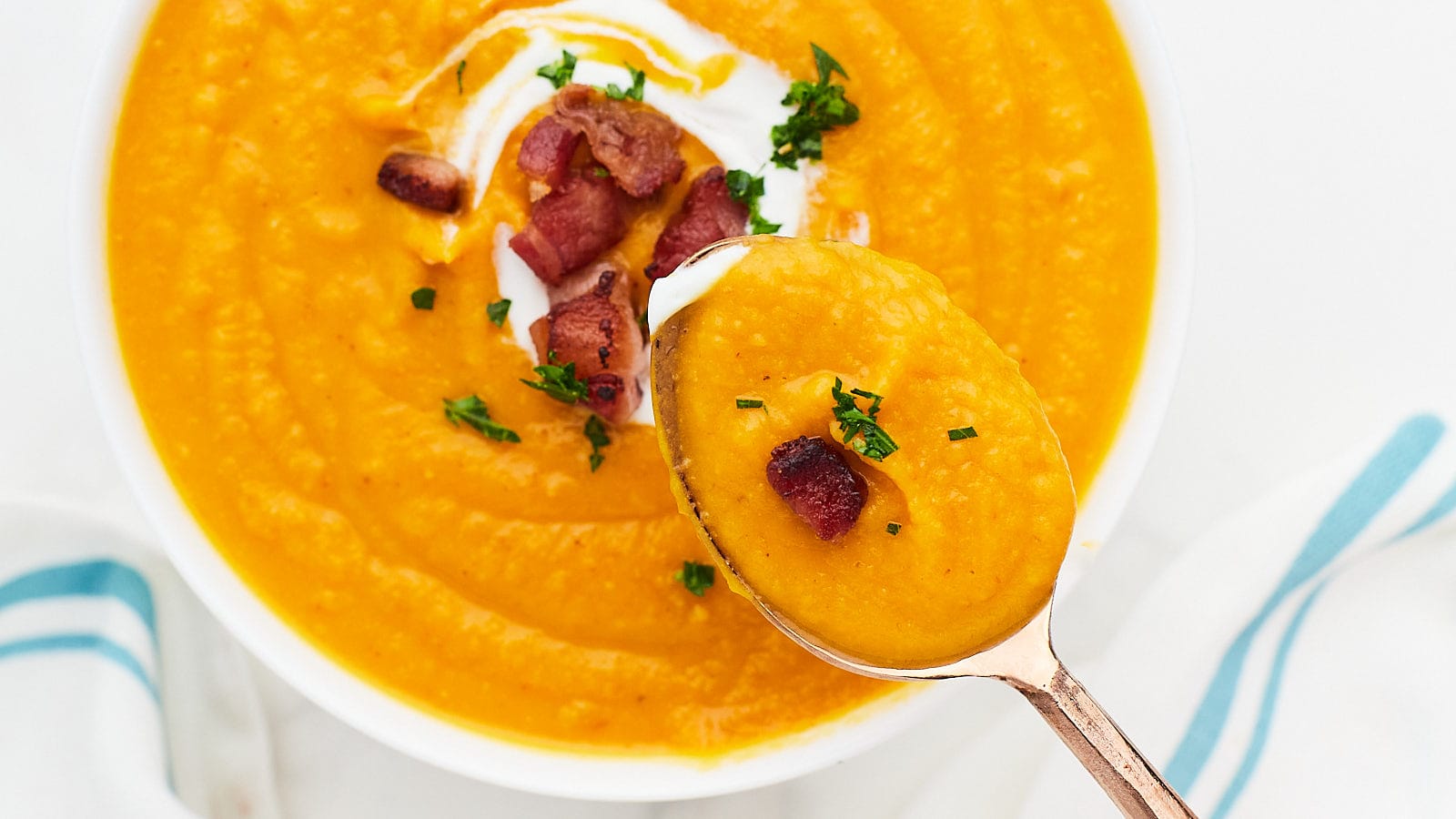Closeup of a bowl of velvety Sweet Potato Soup.