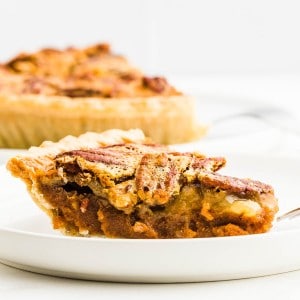 A closeup of a slice of freshly baked a Sweet Potato Pecan Pie