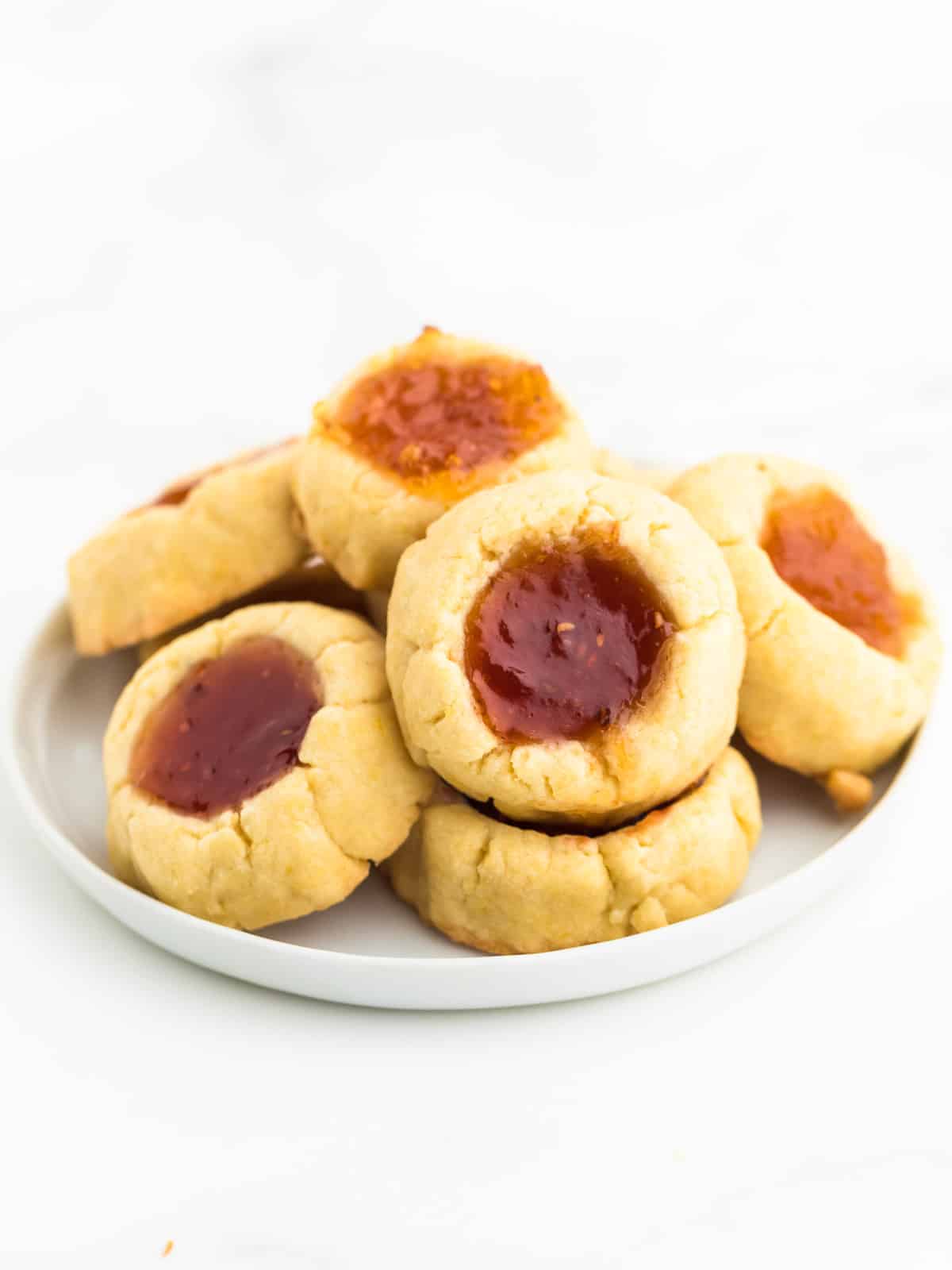 A plate of freshly baked Thumbprint Cookies.