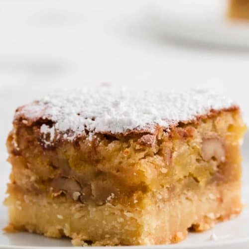 a slice of freshly baked apricot bars dusted with powdered sugar