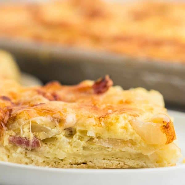 A slice of freshly baked onion pie (German Zwiebelkuchen).