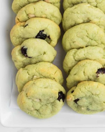 Freshly baked Pistachio Cookies on a white plate