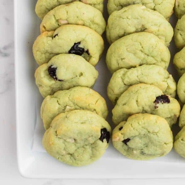 Freshly baked Pistachio Cookies on a white plate
