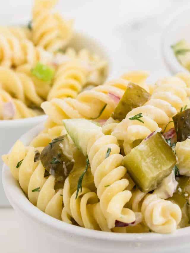 Freshly made Dill Pickle Pasta Salad in a white bowl.