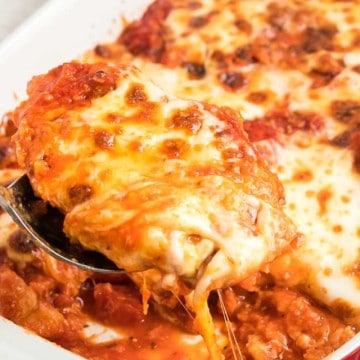 a closeup of scoop of chicken parmesan