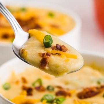 A spoonful of freshly cooked Old-Fashioned potato soup.