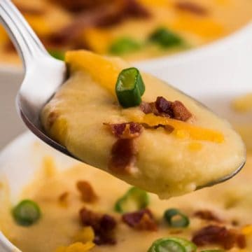 close up of of a hot, creamy spoon full of old fashioned potato soup