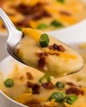 close up of of a hot, creamy spoon full of old fashioned potato soup