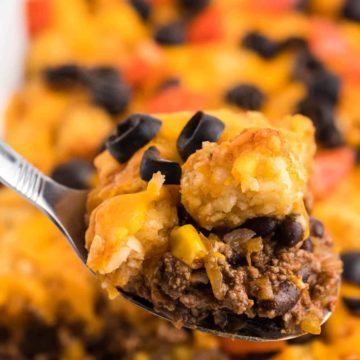 a closeup of a spoonful of freshly cooked taco tater tot casserole