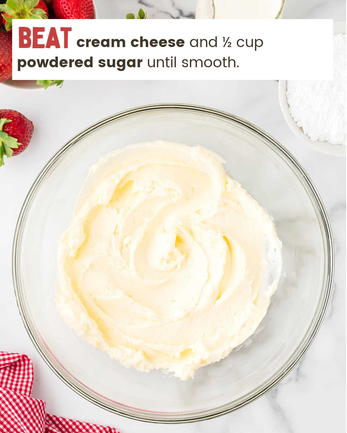 Mixing sugar and cream cheese for Strawberry Pie.