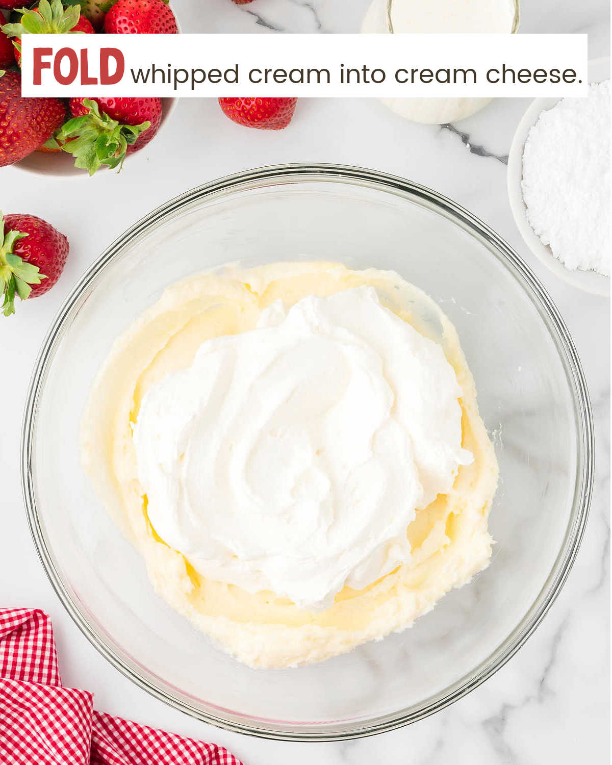 Mixing whipped cream and cream cheese for Strawberry Pie.