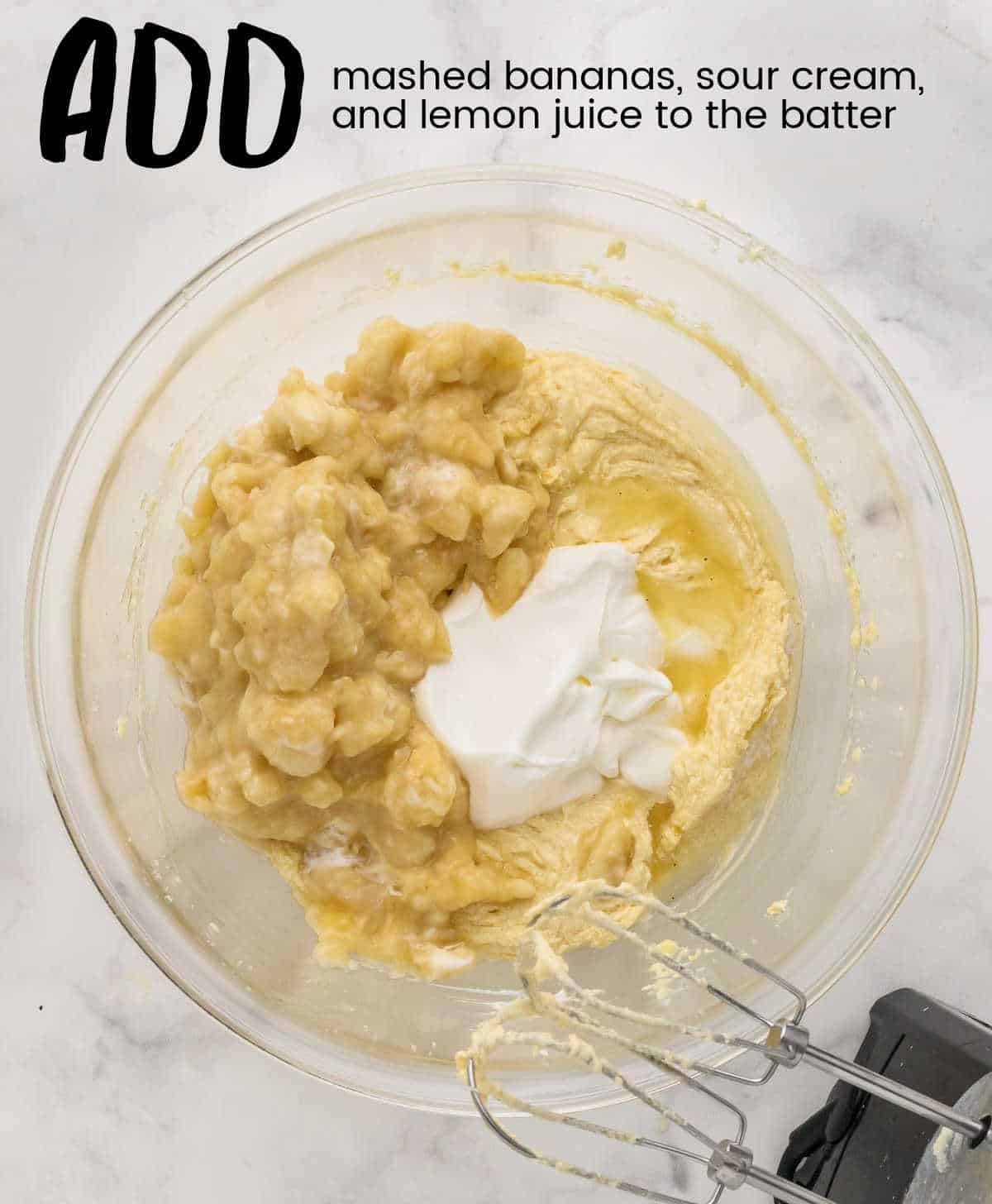adding mashed bananas and sour cream to the batter