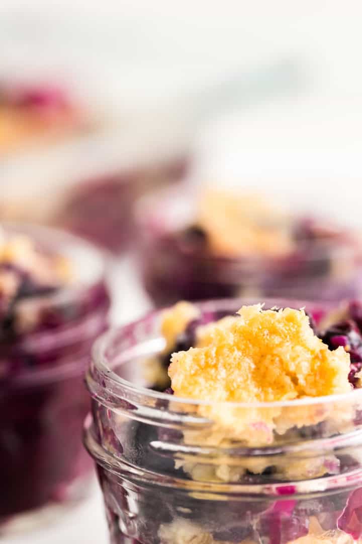 blueberry dump cake served in small mason jars (perfect for picnics)