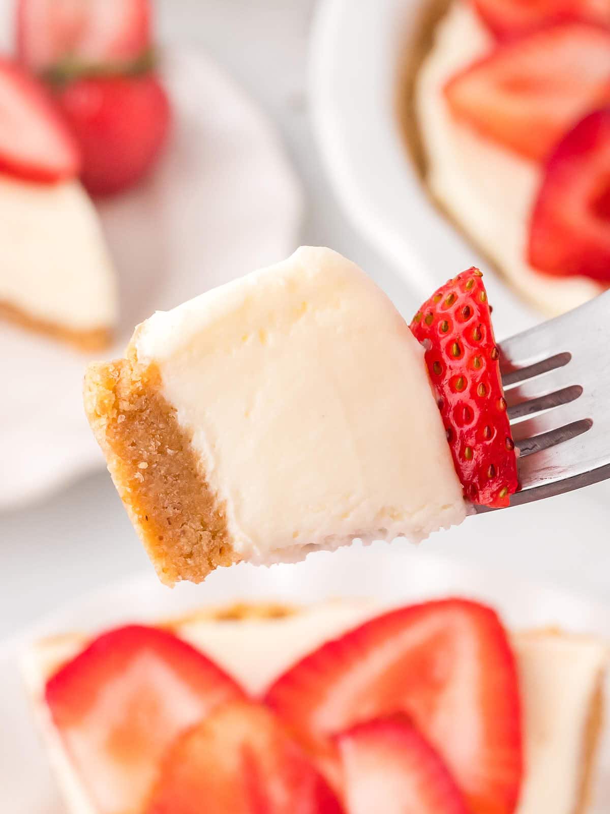 Closeup of a forkful of creamy Strawberry Pie.