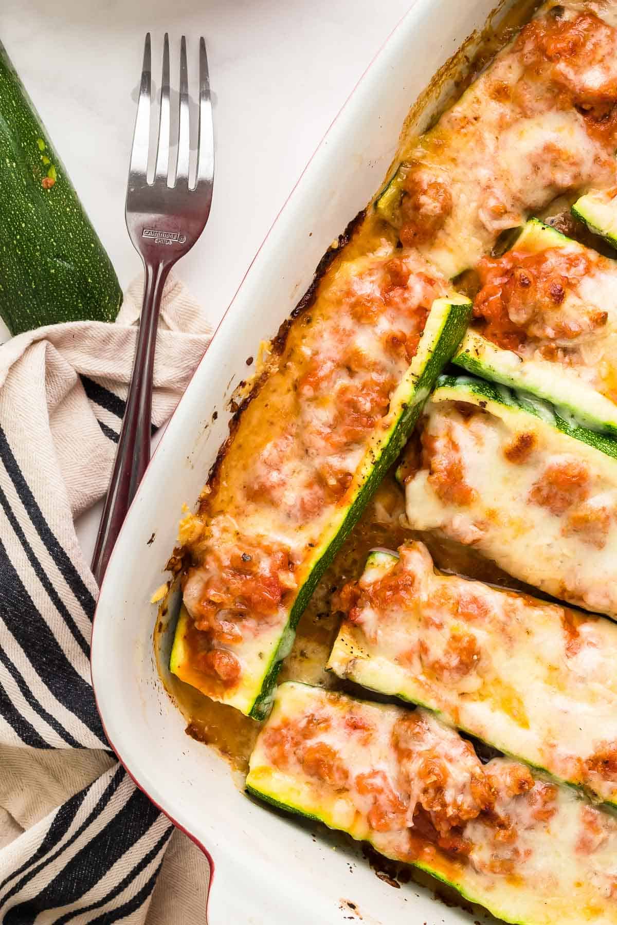 Stuffed Zucchini Boats in a casserole dish fresh from the oven