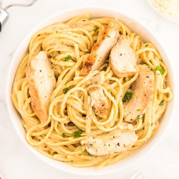 Chicken Alfredo in a white bowl